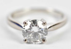 An 18ct white gold single stone diamond solitaire ring, the four claw set round brilliant cut