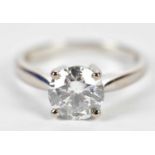 An 18ct white gold single stone diamond solitaire ring, the four claw set round brilliant cut