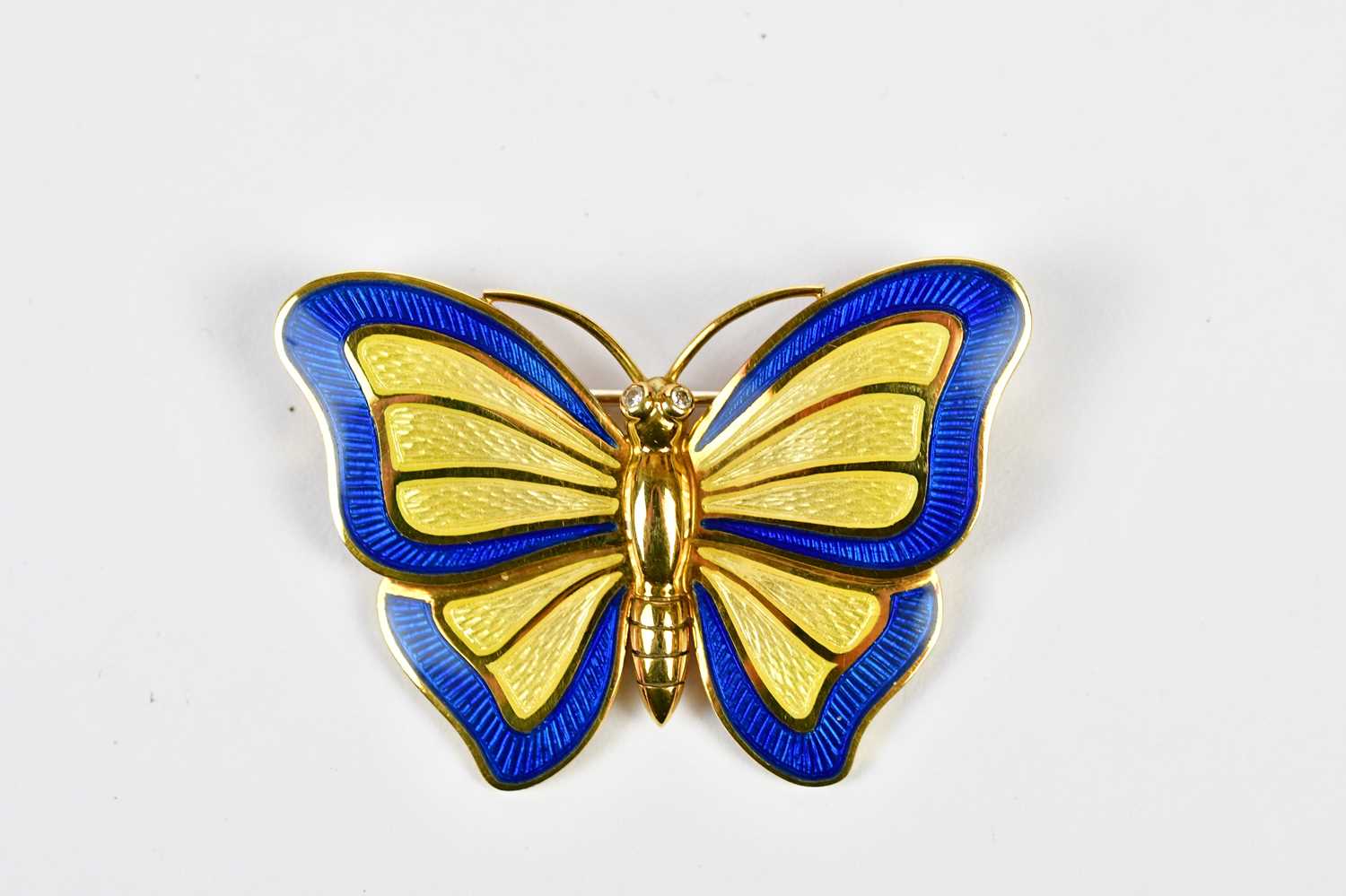 DE VROOMEN; an 18ct yellow gold enamel decorated butterfly brooch, width 43mm, approx 14.16g,