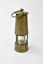 A vintage brass miner's lamp, 'The Protector Lamp & Lighting Co, Eccles, Manchester', type 6 M&Q,