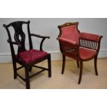 A George III style mahogany dining chair, in the Chippendale style, with scroll arms, on moulded