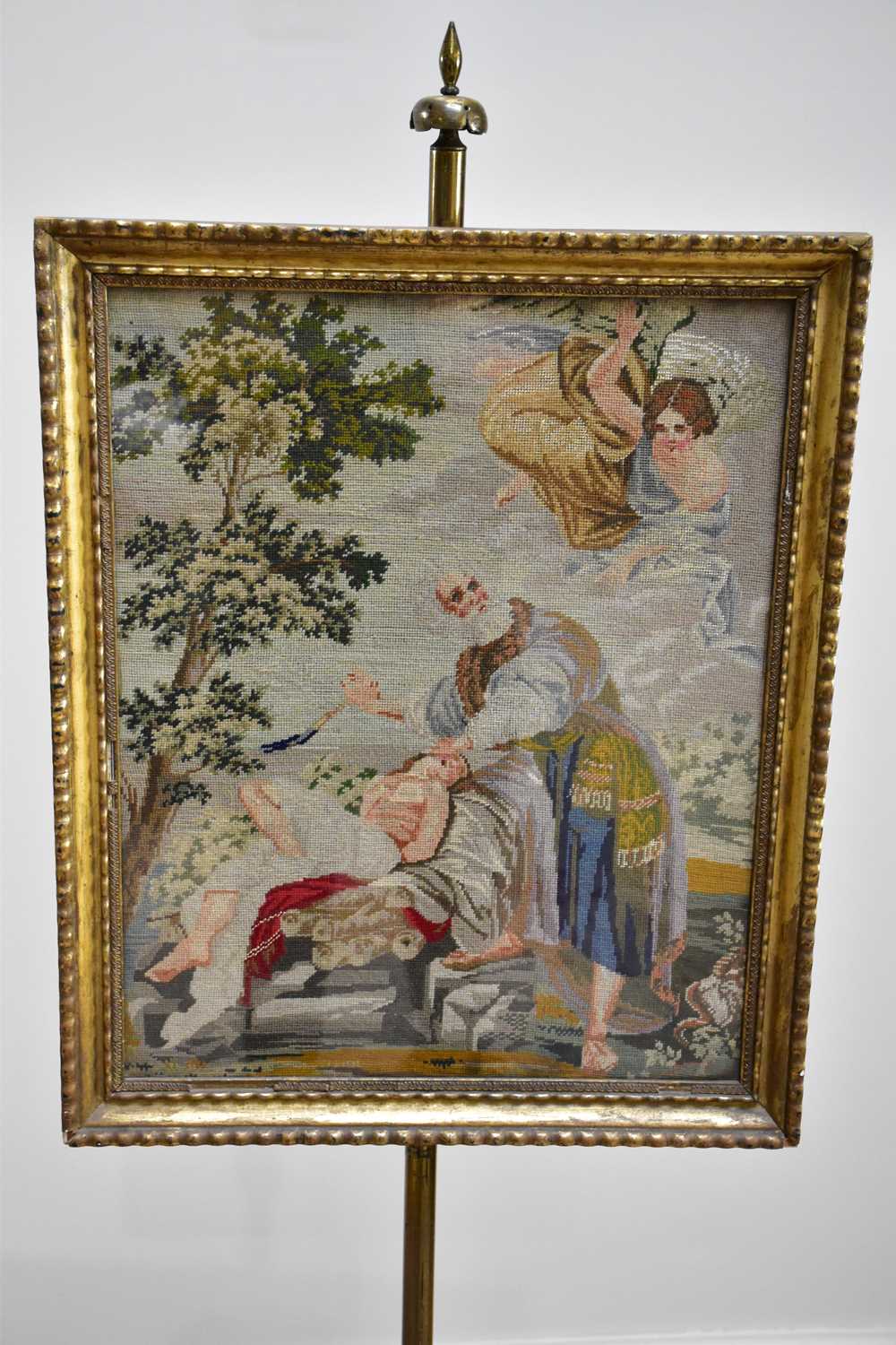 A Victorian pole screen with framed tapestry panel of a religious scene, on tripod base, height - Image 2 of 3