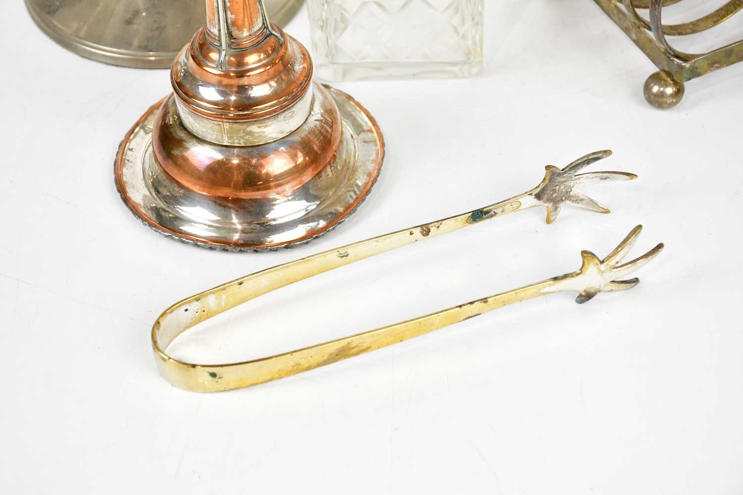 A pair of silver plated toast racks, silver plated sugar tongs, a pair of stainless steel three - Image 5 of 5