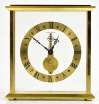 JAEGER-LECOULTRE; a gilt metal cased skeleton clock, the chapter ring set with Roman numerals,