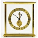 JAEGER-LECOULTRE; a gilt metal cased skeleton clock, the chapter ring set with Roman numerals,