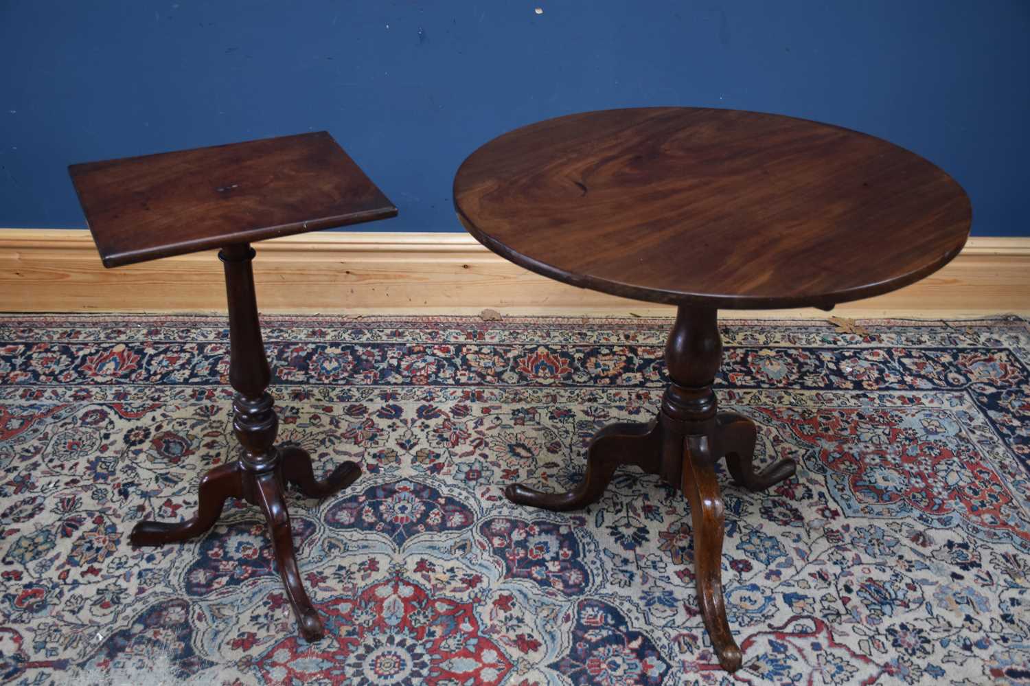 A 19th century mahogany and oak tilt-top tripod table and a mahogany tripod table, height 70cm (2).