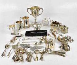 A small quantity of assorted plated flatware, a twin handled trophy cup, various mugs, etc.