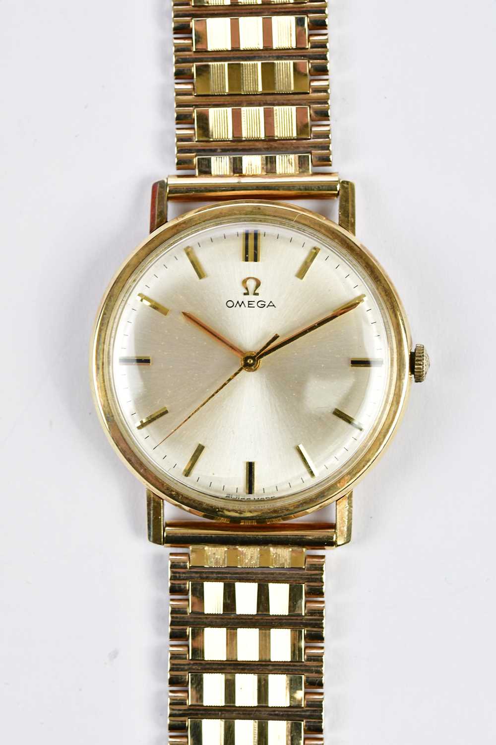 OMEGA; a vintage gentleman’s wristwatch with baton markers to the circular dial and with 9ct