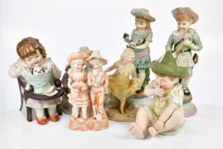 A collection of late 19th/early 20th century Continental painted bisque figures including a boy