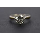 An 18ct white gold diamond solitaire ring, the eight claw set round brilliant cut stone weighing