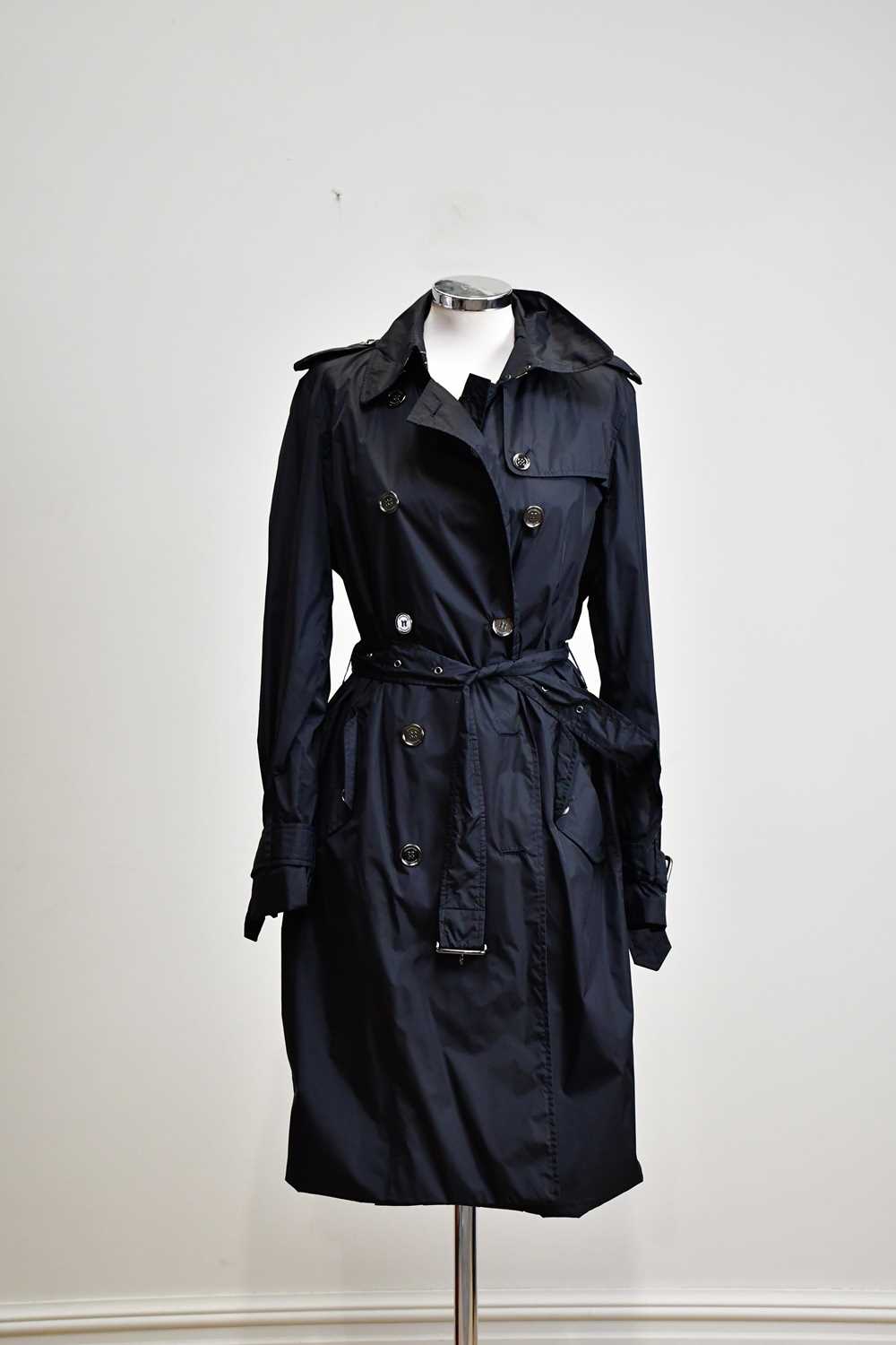 BURBERRY; a full length black mac trench coat with part Nova check lining, belt and collar, size 14.