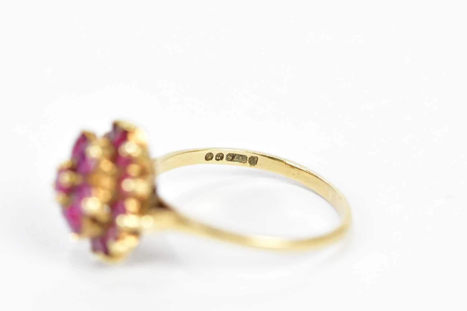 A 9ct yellow gold dress ring, set with a melee of red stones, size N 1/2, approximate weight 3.5g. - Image 3 of 3