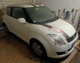 A SUZUKI Swift petrol three door hatchback, 1328cc, registration MA10BYC, with one key and V5