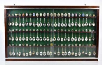 A large collection of approximately three hundred and twenty-eight souvenir spoons, including
