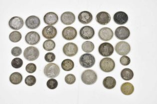 A collection of twenty-one silver shillings, comprising 1817 (x2), 1819, 1820, 1826, 1883 (x2), 1887