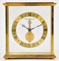 JAEGER-LECOULTRE; a gilt metal cased skeleton clock, the chapter ring set with Roman numerals,
