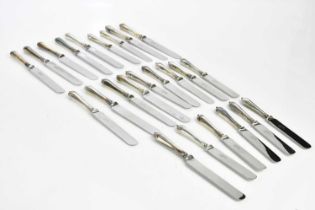 A set of twelve large table knives and twelve matching smaller table knives with steel blades and