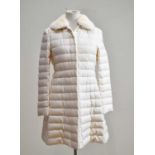 MONCLER; an unused cream padded coat with cream mink fur detachable collar, front silver tone zip,