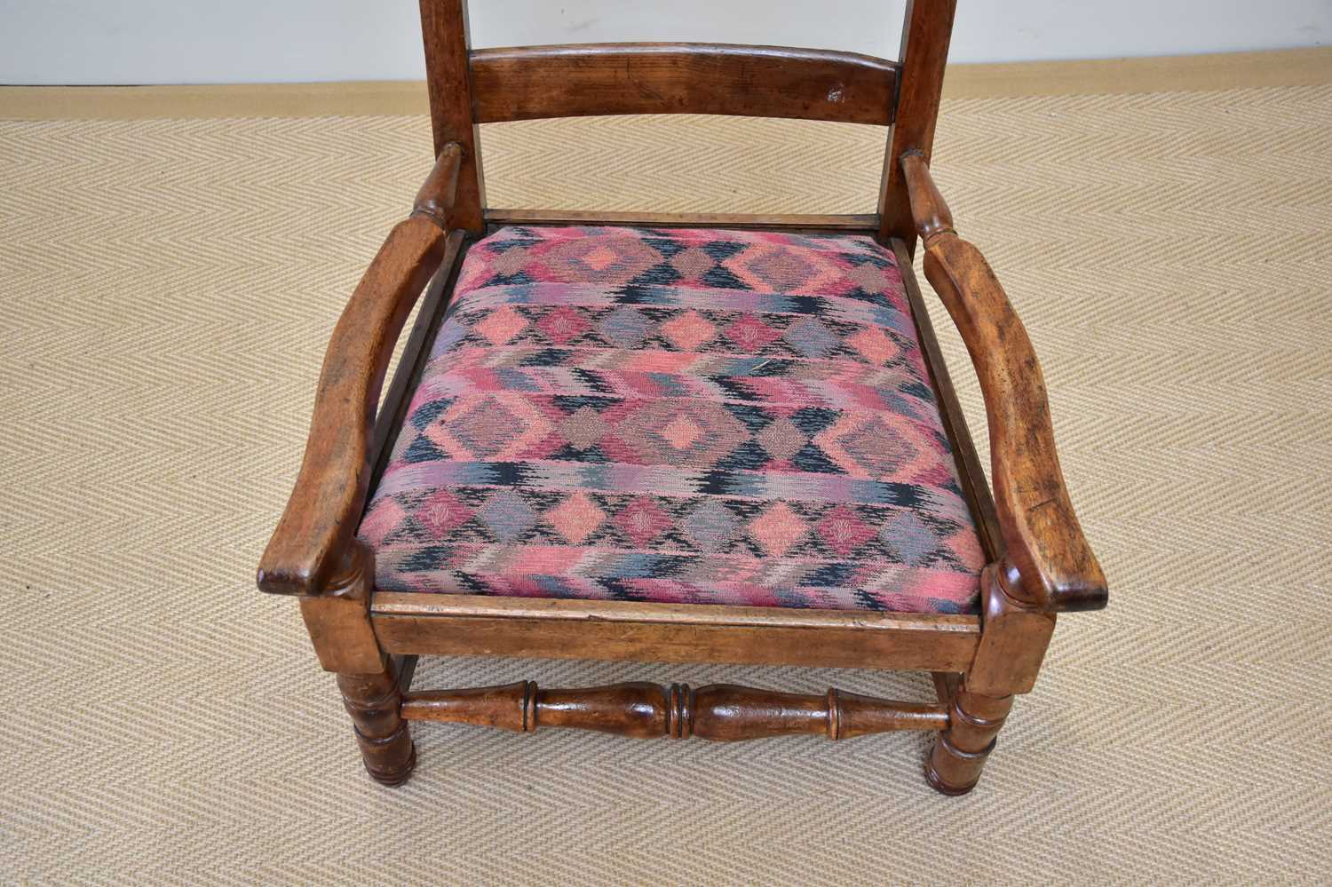 A 19th century ladderback elbow chair with drop-in seat. - Image 2 of 3