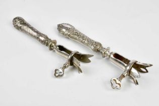 Two French white metal lamb bone holders, with foliate detailing, length 21cm (2)