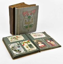 Three vintage postcard albums containing various postcards, including various birthday examples,