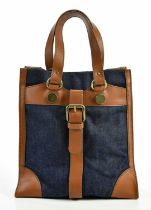 DOLCE & GABANNA; a blue denim and tan thick leather handbag with brass tone hardware buckles, pop