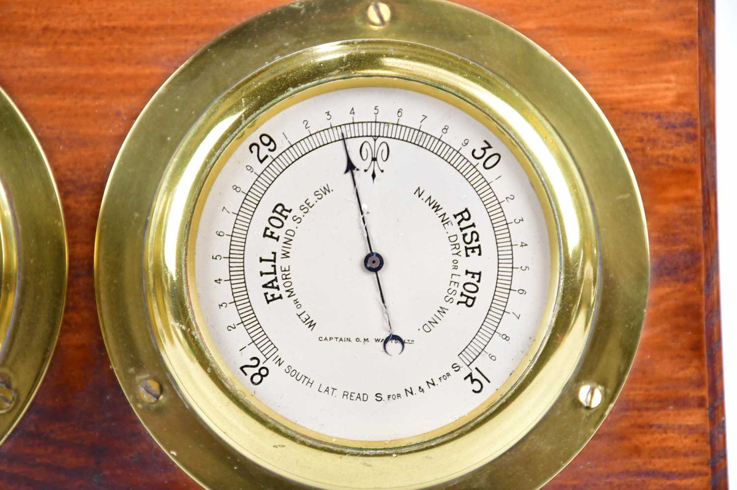 CAPTAIN O M WATTS; a brass cased ship's clock set with Roman and Arabic numerals, with thermometer - Image 3 of 4