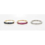 A white metal full eternity ring set with diamonds, size M, a yellow metal square sapphire set