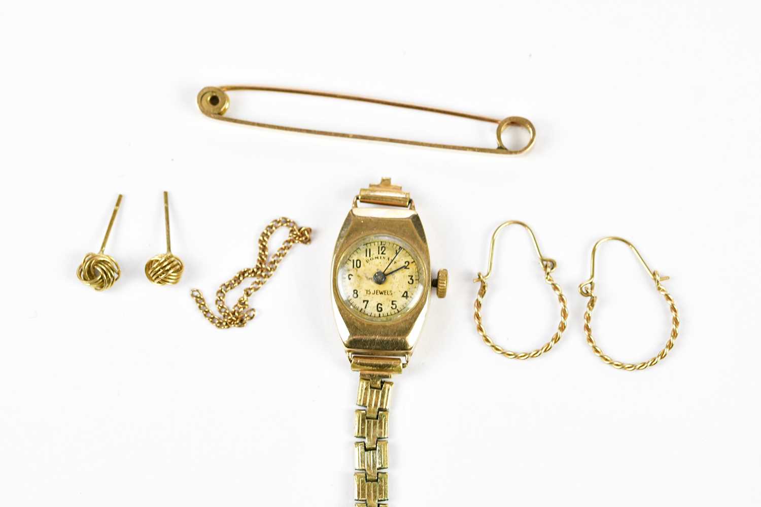 A vintage 9ct yellow gold wristwatch, a 9ct gold tie pin, a pair of knot studs, and a pair of