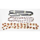 A double strand natural pearl necklace and two further necklaces (3).