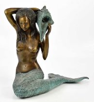 A modern decorative patinated bronze figure of a mermaid holding conch shell, height 50cm.