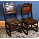 A pair of oak back stools, circa 1700, with panelled backs and plank seats, on turned and block