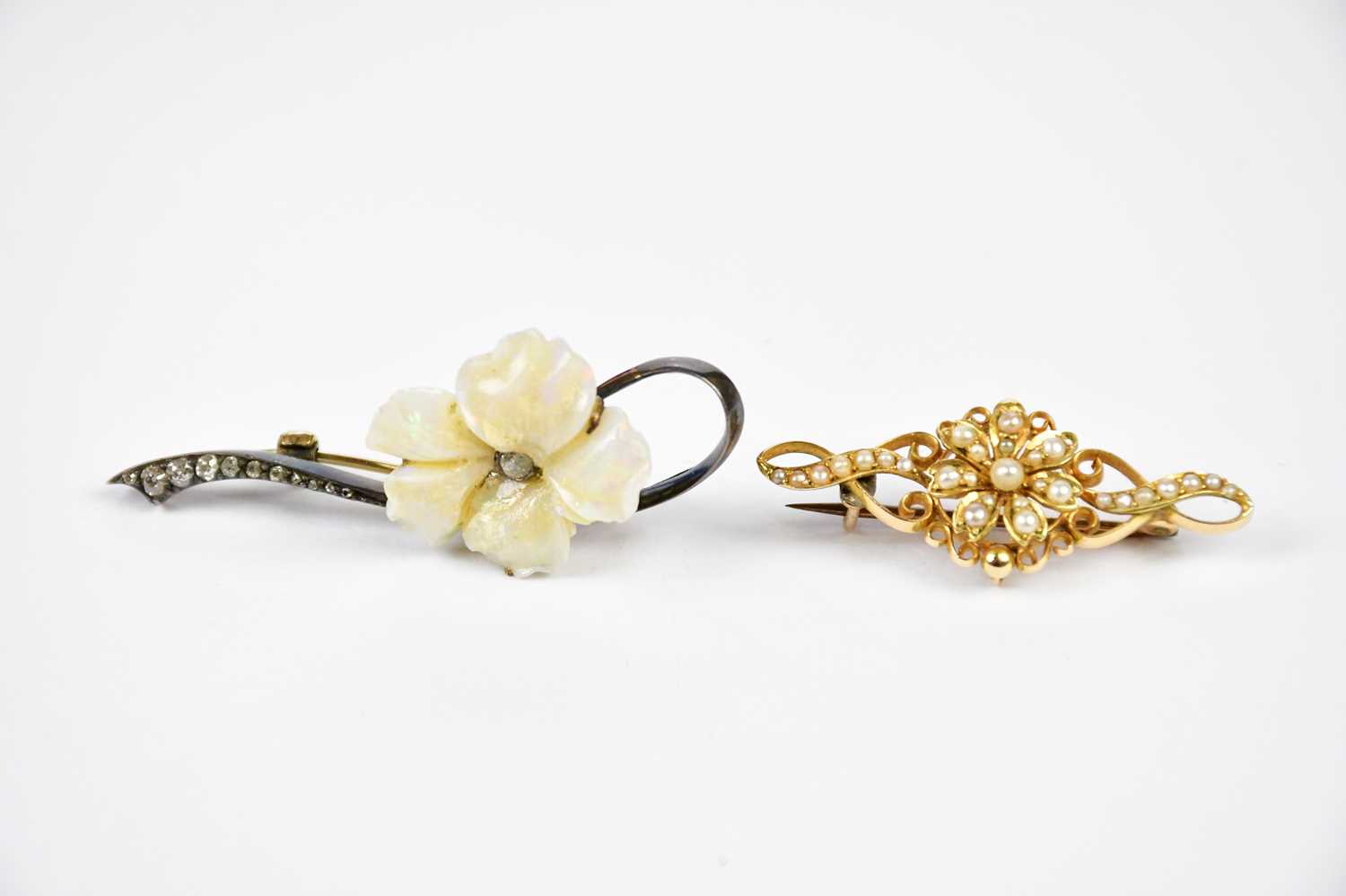 A Victorian yellow gold seed pearl set bar brooch, approximate weight 3.5g and a floral pendant with