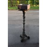 A cast iron jardiniere stand, with associated top, height 124cm.