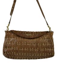 MIU MIU; a quilted tan brown leather studded flap tote bag, with gold tone brand logo to top flap, a