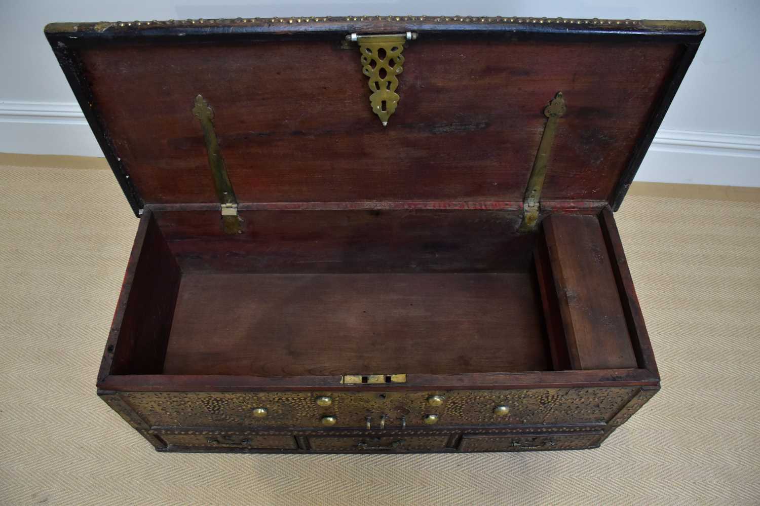 An early 20th century Zanzibar chest with applied studded decoration and hinged top above three - Image 3 of 6