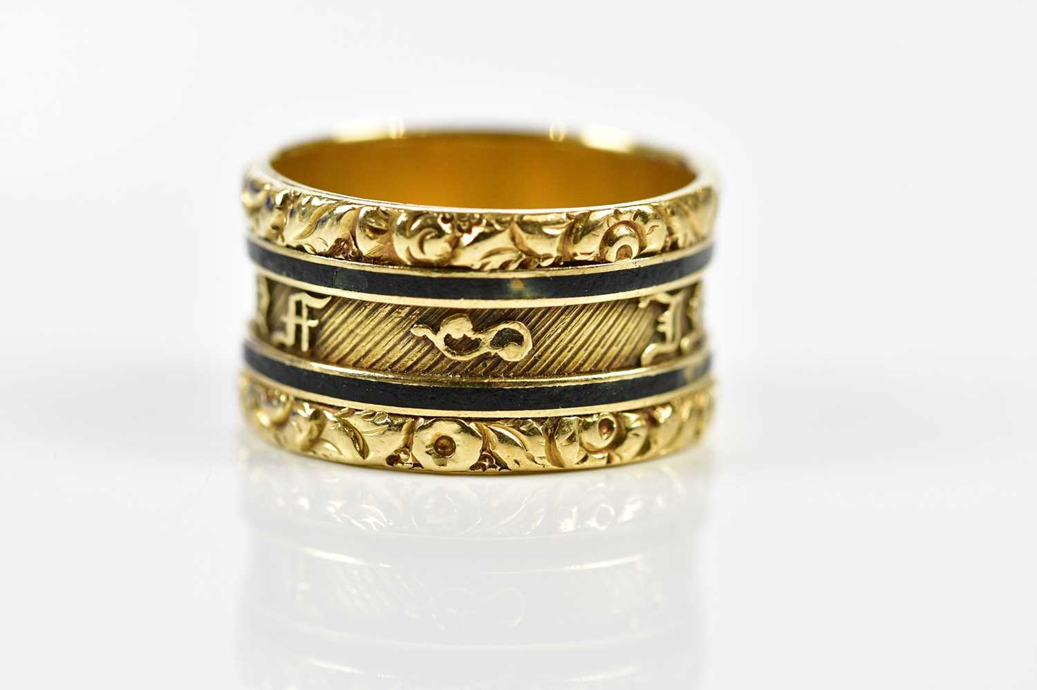 An 18ct yellow gold black enamelled mourning ring, the outer band inscribed 'In Memory Of', the - Image 2 of 3