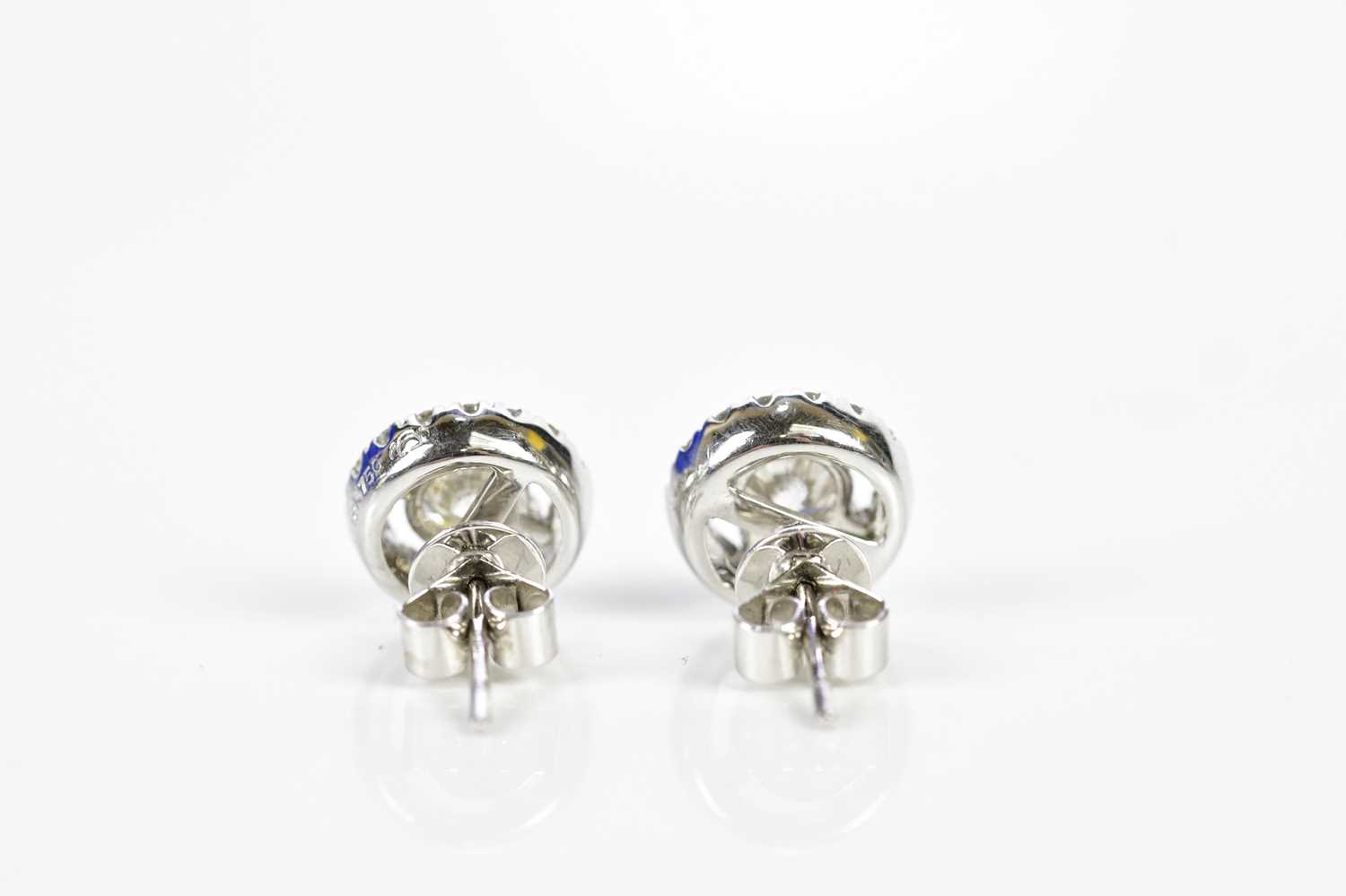 A pair of 18ct white gold and diamond halo set ear studs, each with central round brilliant cut - Image 4 of 5