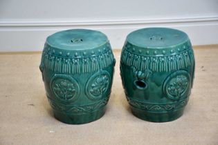 A pair of modern green glazed Chinese garden seats with relief moulded decoration, height 42cm (2)