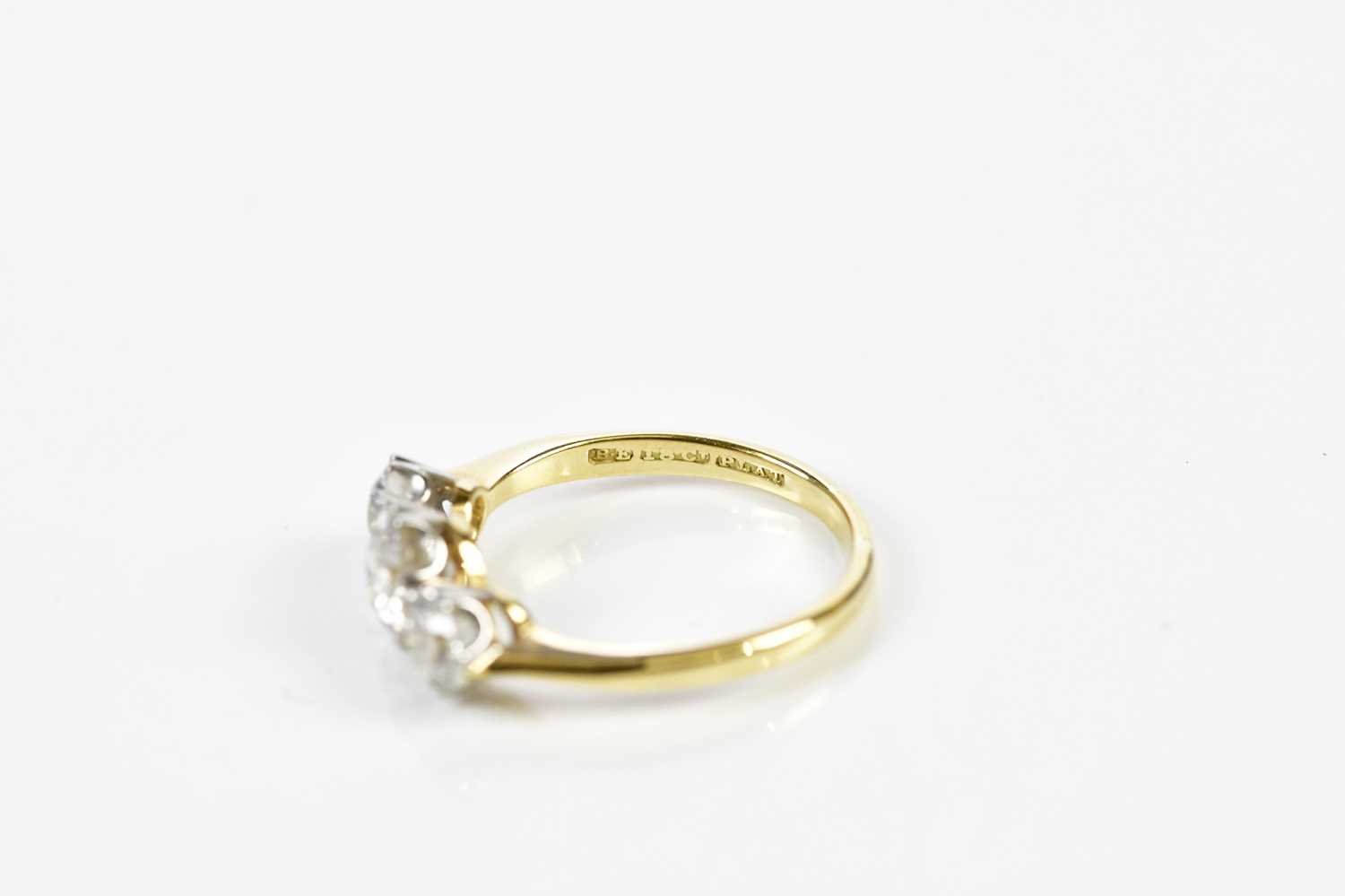 An 18ct yellow gold three stone diamond ring, the central old cut stone weighing approx. 1.20cts, - Image 3 of 3