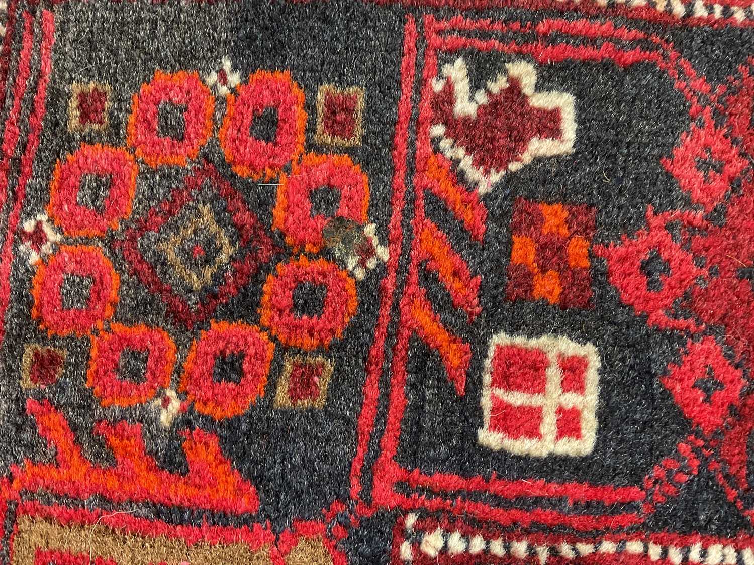 A Caucasian hand woven wool runner, worked with geometric detailing against a red ground, 355 x - Image 3 of 3