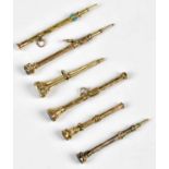 Six Victorian yellow metal propelling pencils, including an example with turqoise set release,