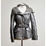 BURBERRY; a silver metallic short fitted quilted jacket with large collar, front zip, lined in