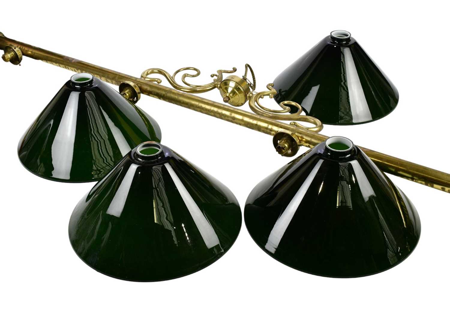 Four vintage green and white glass light shades, diameter 34.5cm, with a brass four light snooker