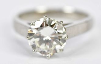 A platinum diamond solitaire ring, the eight claw set round brilliant cut stone weighing approx. 3.