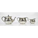 MAPPIN & WEBB; a silver plated three piece tea service with cast beaded rims and chased decoration.