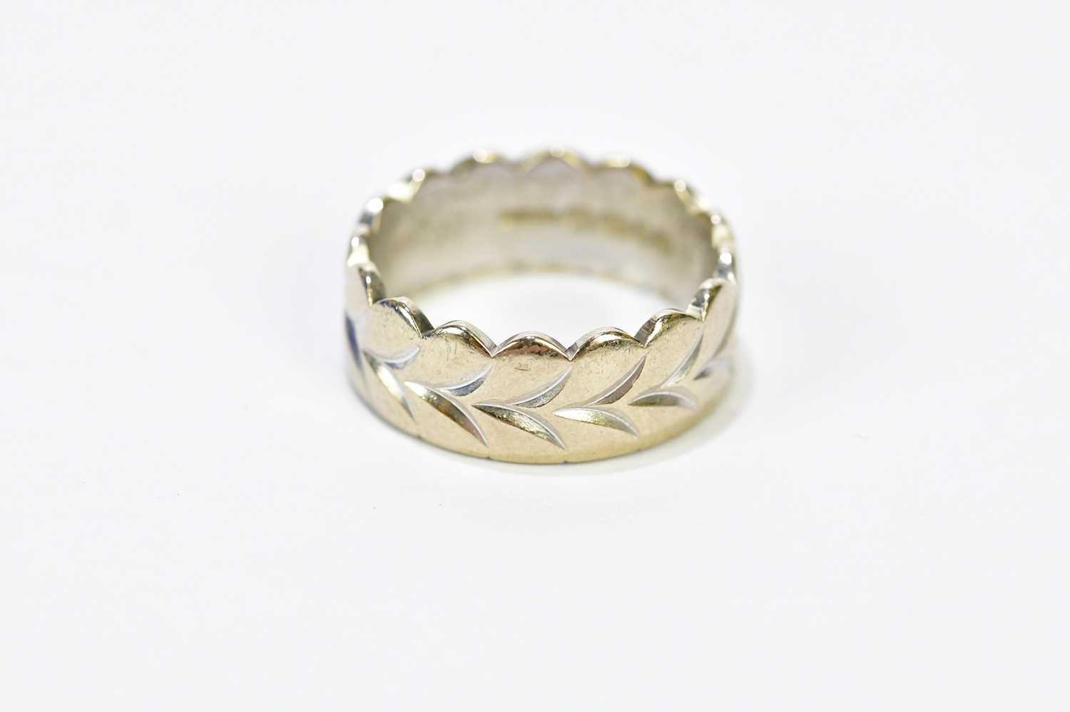 An 18ct white gold and yellow gold engraved wedding band, size L, approx. 7.36g. - Image 2 of 3