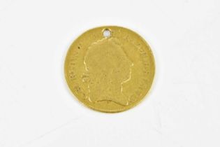 A George III guinea, 1776, (holed) Condition Report: weight 7.9g