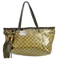 GUCCI; a patent MM canvas tassel shoulder bag with two top handles, two large bamboo and brown