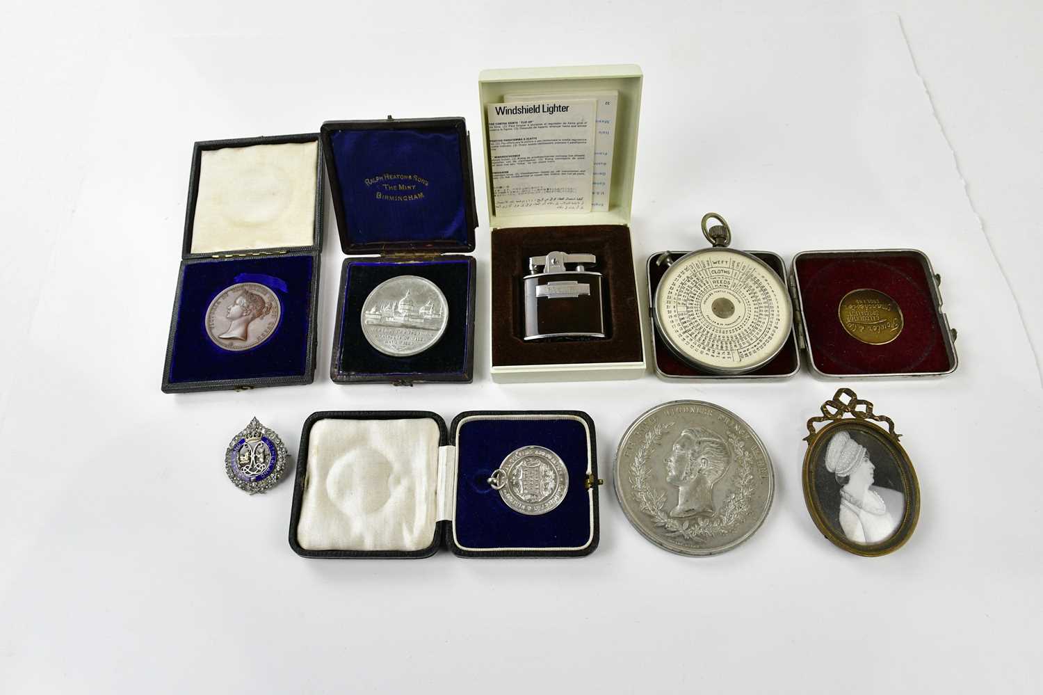 An assortment of collectors' items including a bronze Victorian medal awarded to Harry G. Cooper